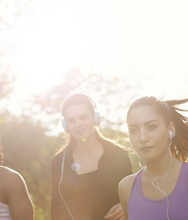 A group of diverse people enjoying a light exercise session outdoors.